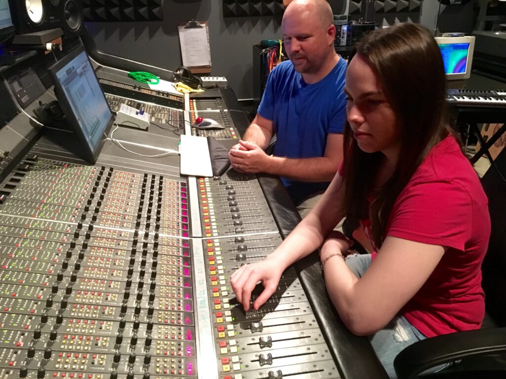 Audio Engineer Pierre Ferguson teaching Recording Connection student Nicole Thorp